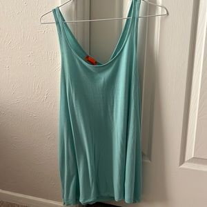 Slightly worn light blue tank top with unique “open” back